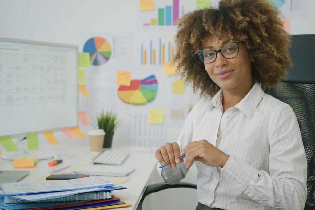 Stylish pretty office worker posing at camera